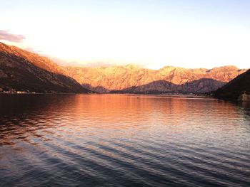 Scenic view of lake against sky during sunset