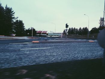 Wet road against clear sky