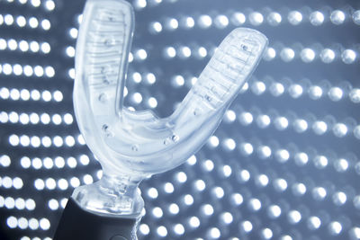 Close-up of braces against lighting equipment