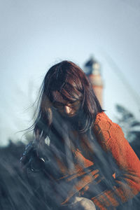 Portrait of woman against sky