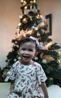 Portrait of girl with christmas tree