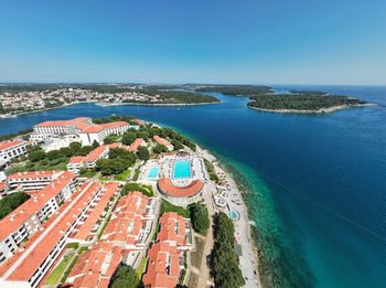 High angle view of sea against clear blue sky