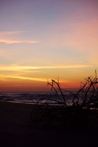 Scenic view of sea against romantic sky