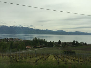 Scenic view of lake against cloudy sky