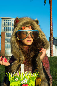 Portrait of young woman wearing sunglasses