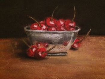 Close-up of cherries on table