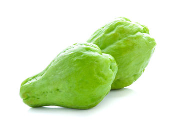 Close-up of green pepper against white background