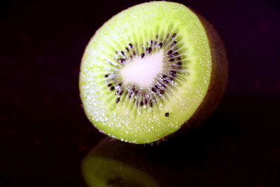 Close-up of lemon slice over black background
