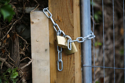 Close-up of padlock on metal fence