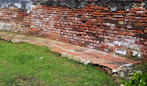 High angle view of brick wall by building