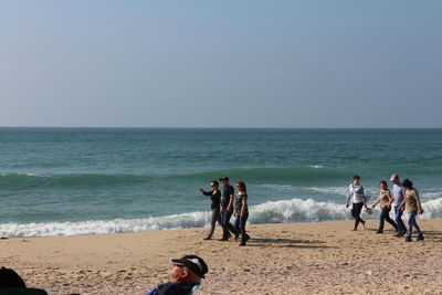 People enjoying at beach