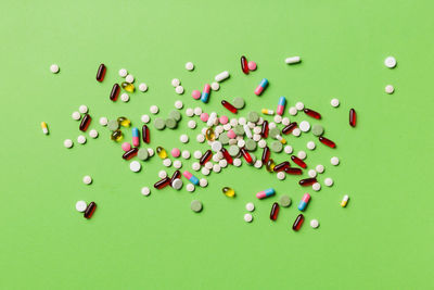 High angle view of colorful candies on blue background