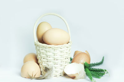 Close-up of eggs against white background