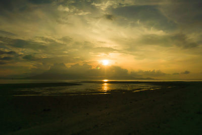 Scenic view of sea against sunset sky