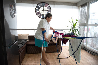 A disabled person washes laundry.