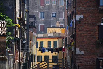 Canal, historic buildings, architecture, sunshine and chill in venice, italy