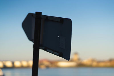 Close-up of telephone pole against sky during sunset