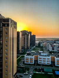 High angle view of buildings against sky during sunset