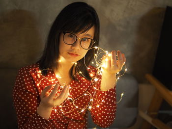 Close-up of young woman using smart phone