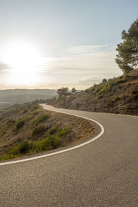 Scenic view of country road against sky