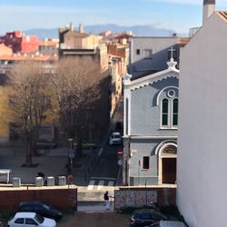 Buildings in city against sky