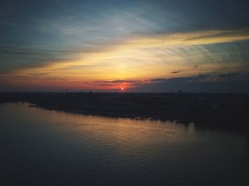 Scenic view of sea against romantic sky at sunset