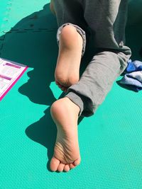 Low section of man sitting on floor