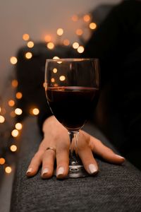 Close-up of hand holding wineglass
