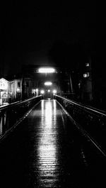 Illuminated street lights in city at night