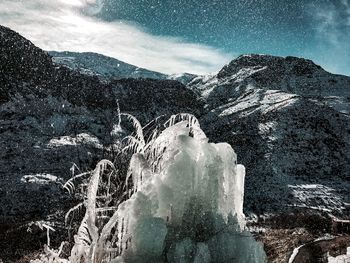 Snow covered mountain against sky