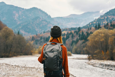 Rear view of man looking at mountains