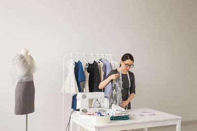 Woman standing on table