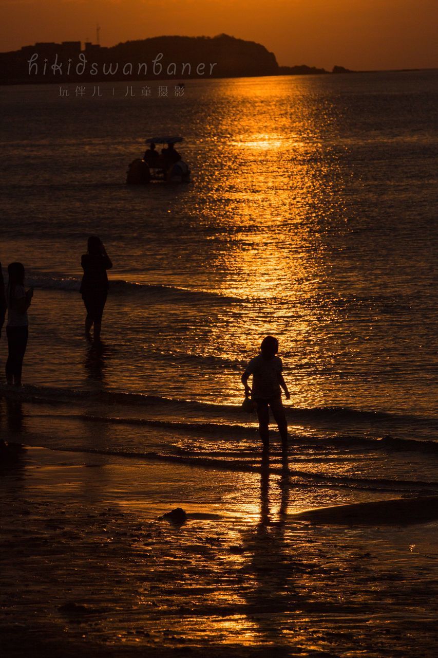 SILHOUETTE PEOPLE ON BEACH DURING SUNSET