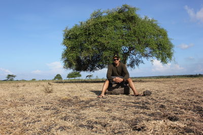 Full length of man on field against sky