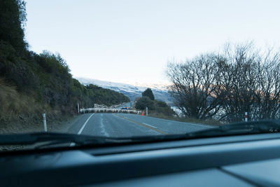 Road seen through car windshield