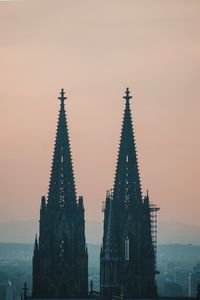 Silhouette of temple against sky at sunset