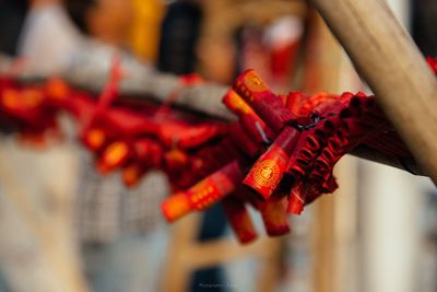 Close-up of red bell hanging outdoors