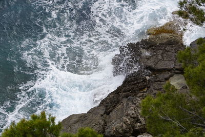 Sea waves splashing on rocks