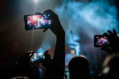 Illuminated lighting equipment on stage at music concert