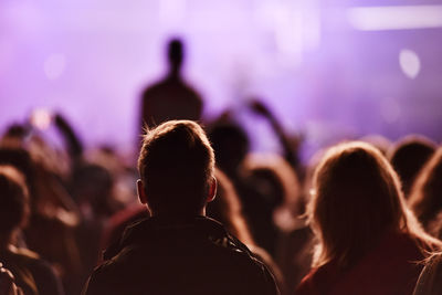 Rear view of crowd enjoying during concert