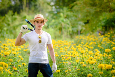 Low section of person standing on field