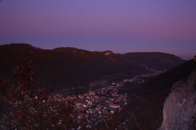 High angle shot of townscape against sky at dusk