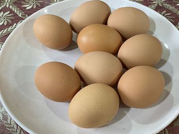 High angle view of eggs in plate on table