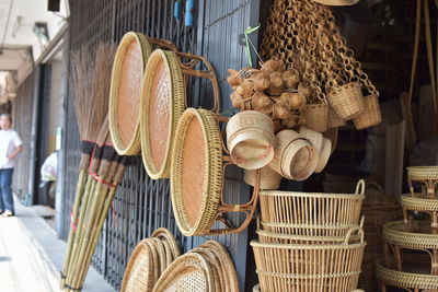 Wicker containers for sale at market stall