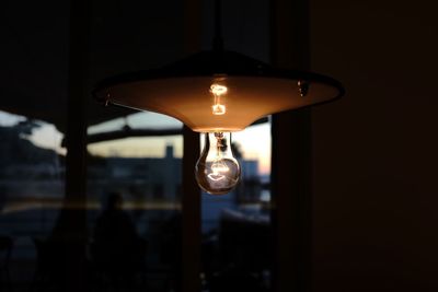 Close-up of illuminated light bulb