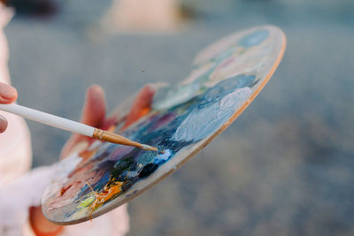 High angle view of hand holding ice cream