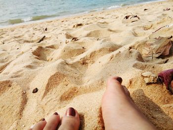 Low section of woman on beach