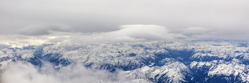 Scenic view of mountains against sky during winter