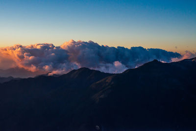 Scenic view of mountains against sky during sunset