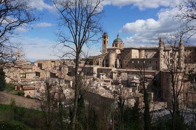 Buildings in city against sky